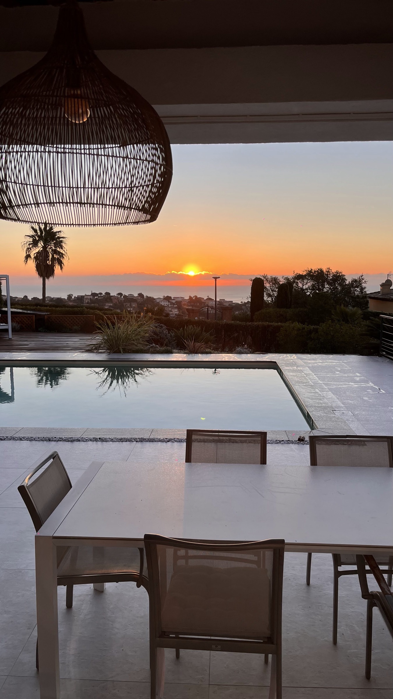 Covered dining terrace at sunset